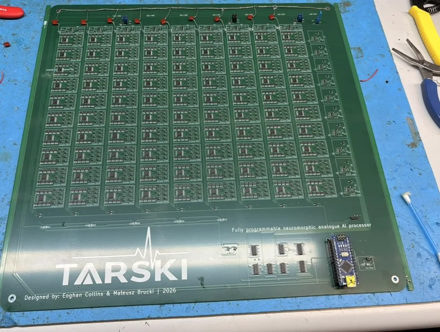 The populated Tarski PCB, a grid of analogue synapse cells on a green four-layer board